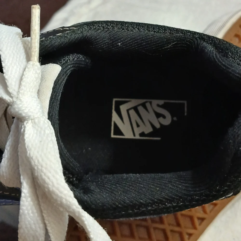 Vans Black Sneakers with Blue Accents and White Laces